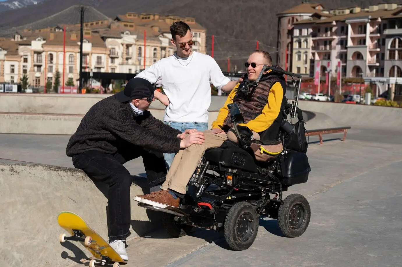 Full-length shot of a man helping his disabled friend